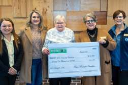 Leaders from the Remington Foundation Board formally presented a check for $75,000 to the NTC Property Foundation to support the Timberwolf Cabins.