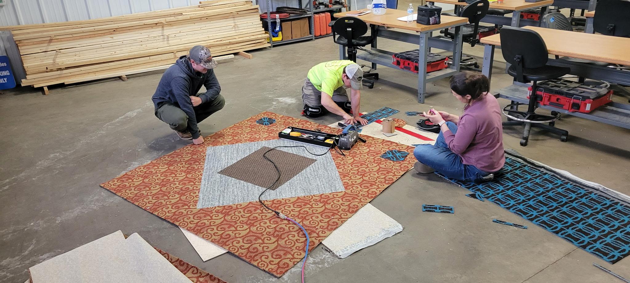 Students in the first cohort of NTC's Floor Installation Technician certificate work on a project