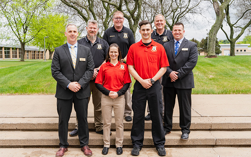 Leaders from NTC’s School of Public Safety stand with the graduate following the commencement ceremony in Wausau, Wis.