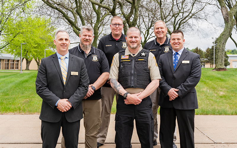 Leaders from NTC’s School of Public Safety stand with the graduate following the commencement ceremony in Wausau, Wis.