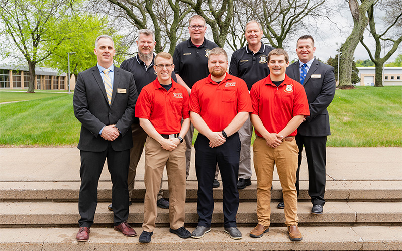 Leaders from NTC’s School of Public Safety stand with the graduate following the commencement ceremony in Wausau, Wis.