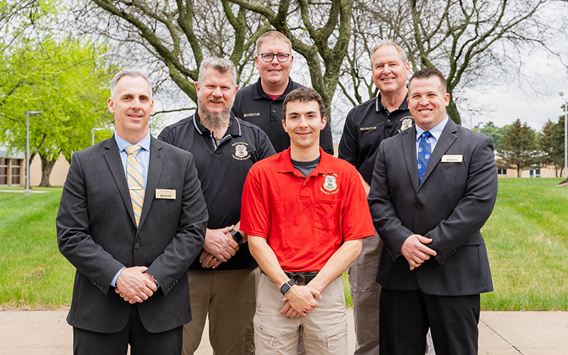 Leaders from NTC’s School of Public Safety stand with the graduate following the commencement ceremony in Wausau, Wis.