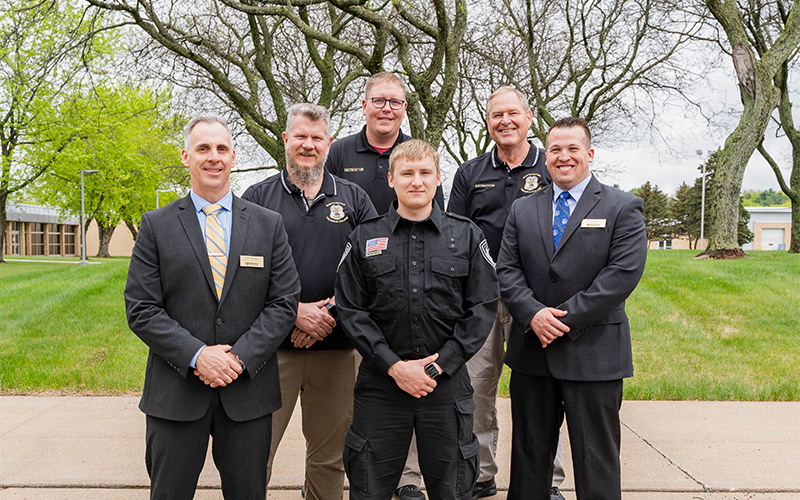 Leaders from NTC’s School of Public Safety stand with the graduate following the commencement ceremony in Wausau, Wis.