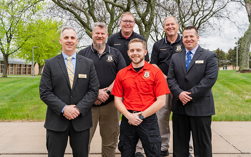 Leaders from NTC’s School of Public Safety stand with the graduate following the commencement ceremony in Wausau, Wis.