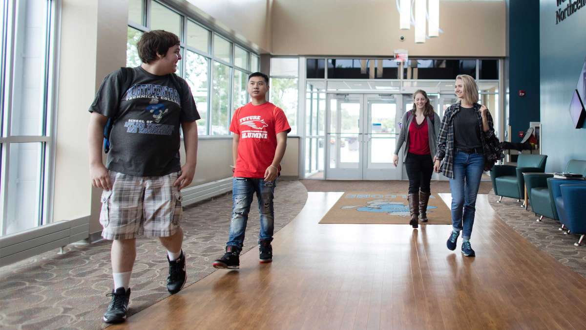 Students walking in the front entrance of the Wausau campus