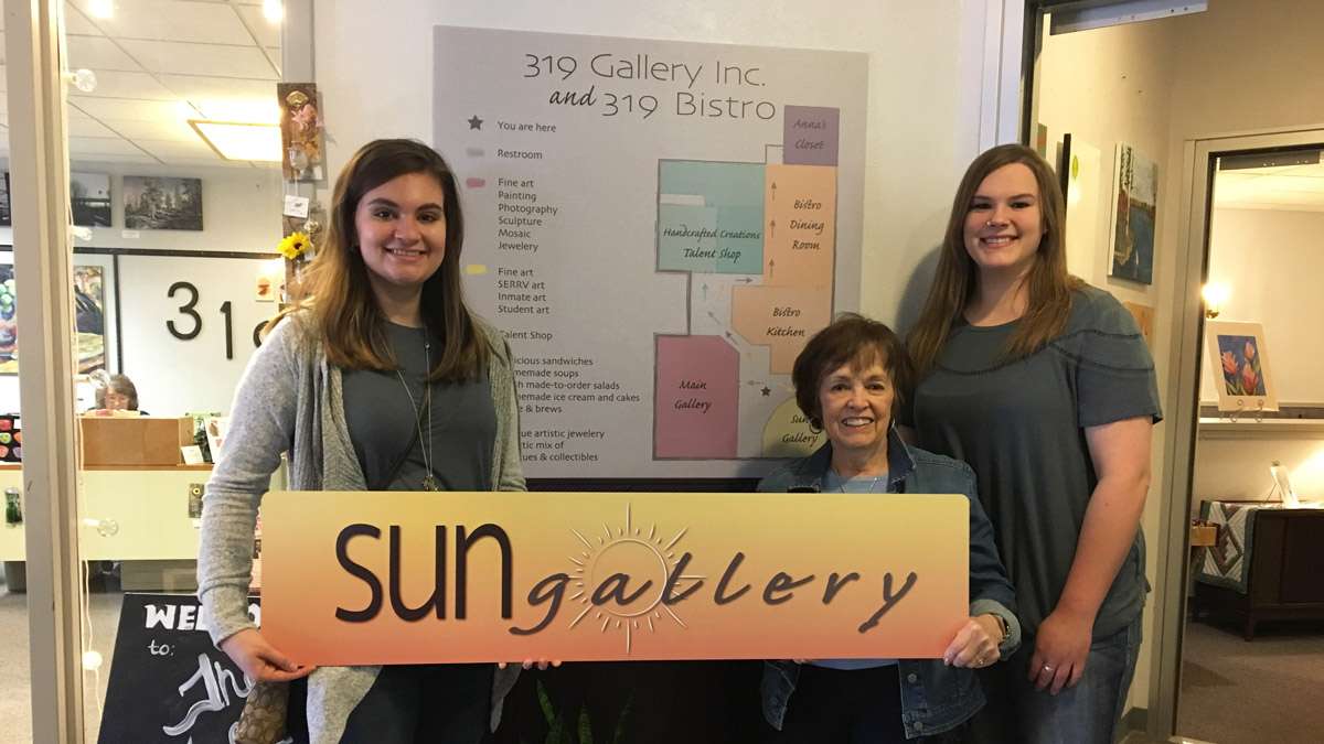 Meghan Weber and Melissa Decker deliver signage to 319 Gallery, Inc.
