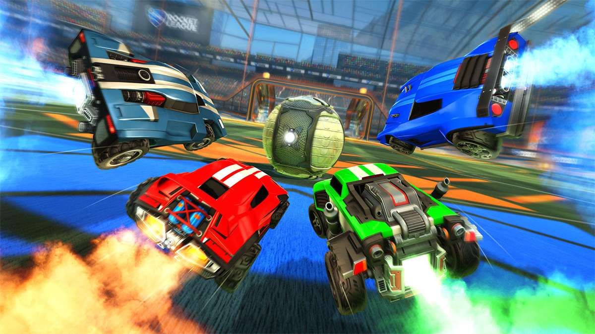 Four cars from Rocket League race to hit the soccer ball into the goal