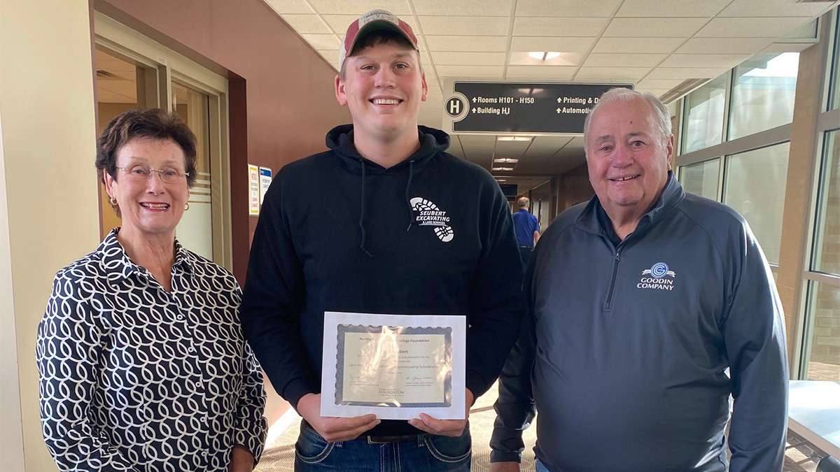 Gloria and Larry Hammond present the first Lorin Hammond Plumbing Apprenticeship Scholarship to Bryce Seubert at NTC.