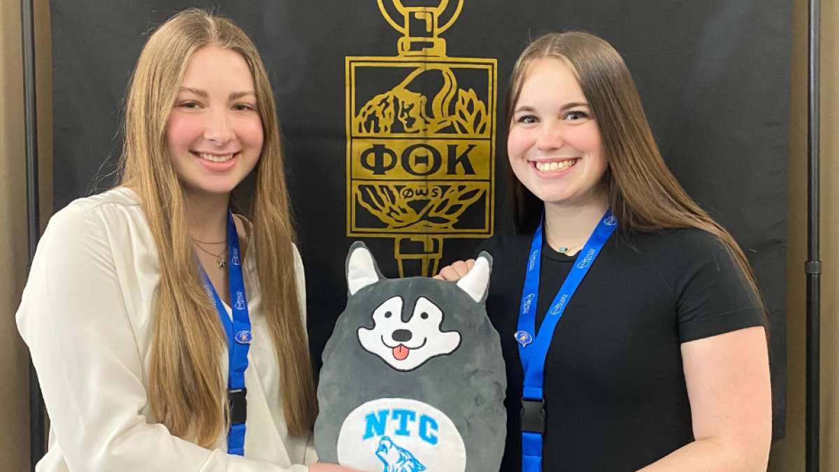 Two NTC Beta Rho Zeta members at a Phi Theta Kappa event