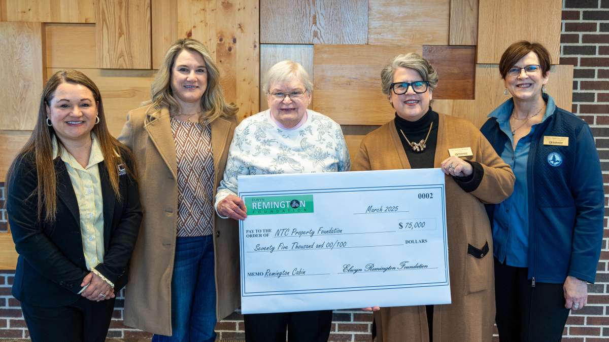 Leaders from the Remington Foundation Board formally presented a check for $75,000 to the NTC Property Foundation to support the Timberwolf Cabins.