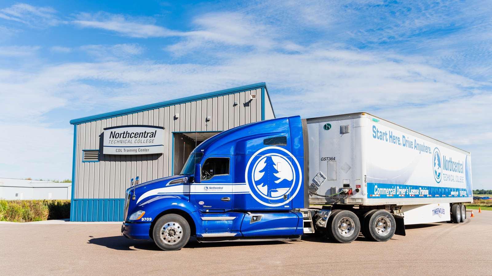 An NTC training truck parked in front of the CDL Training Center.