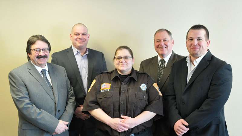 Jail Academy Jail Graduate Sackman stands between her instructors