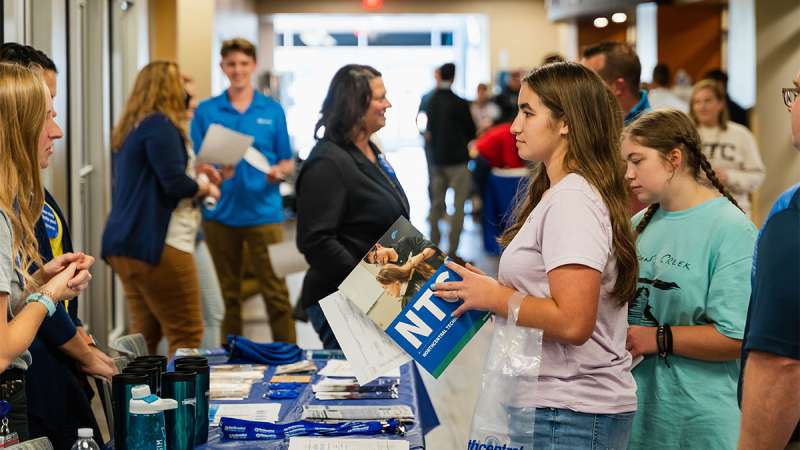 Prospective students and their parents are being informed by staff of opportunities at Northcentral Technical College.