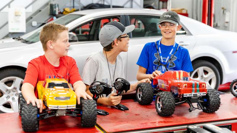 Three preteen boys participating in the NitroX Camp