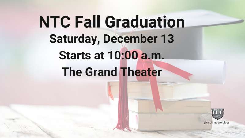 Graduation cap, rolled diploma with red ribbon, and stacked books on a wooden surface. A university logo appears in the bottom right corner.