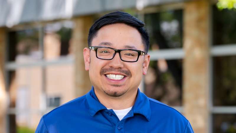 TouXoua, portrait, outside the Wausau Campus building