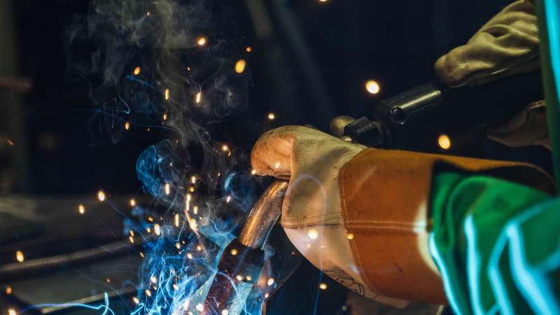 Sparks fly as a student welds