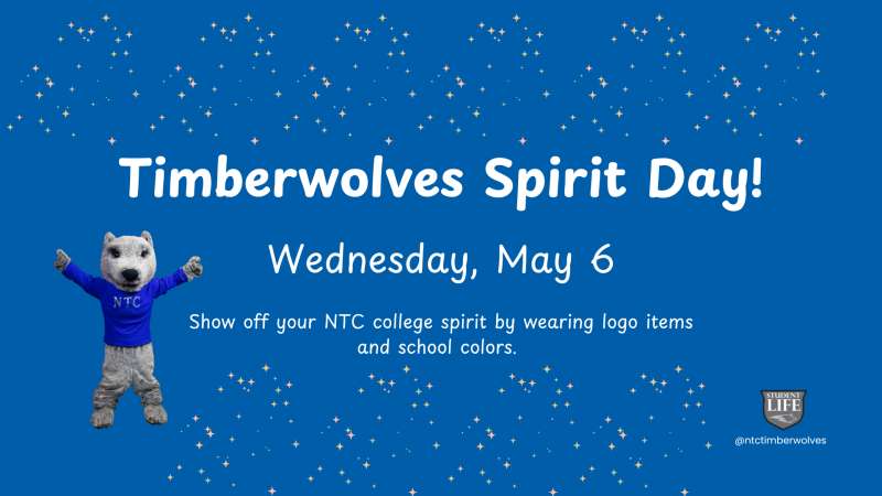 Blue confetti background with a waving Timberwolves mascot in a blue jersey; bold headline "Timberwolves Spirit Day! Wednesday, May 6" and a small logo bottom-right.