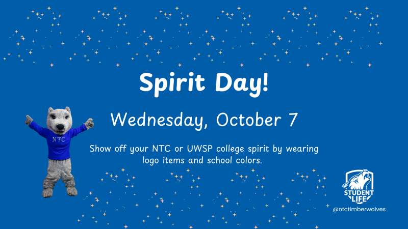 Spirit Day announcement: Wednesday, October 7; school mascot polar bear in blue sweater and jeans waving on blue star-speckled background, small school logo lower right.