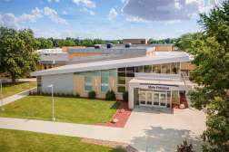 Aerial view of the Northcentral Technical College front entrance under a blue sky with scattered clouds.