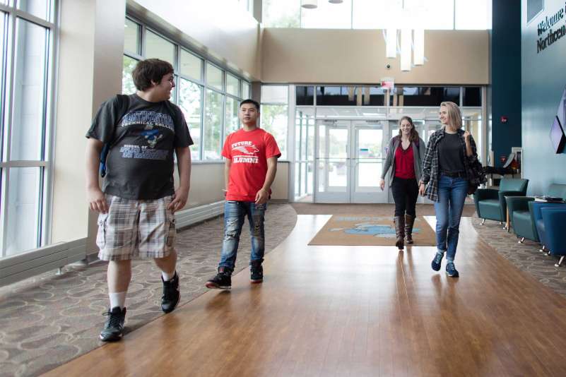 Students walking in the front entrance of the Wausau campus