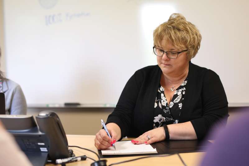 Businesswoman works on a writing a grant.