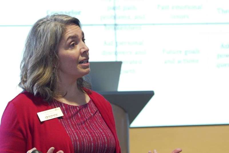 Tonya McKenna Trabant speaking near a podium.