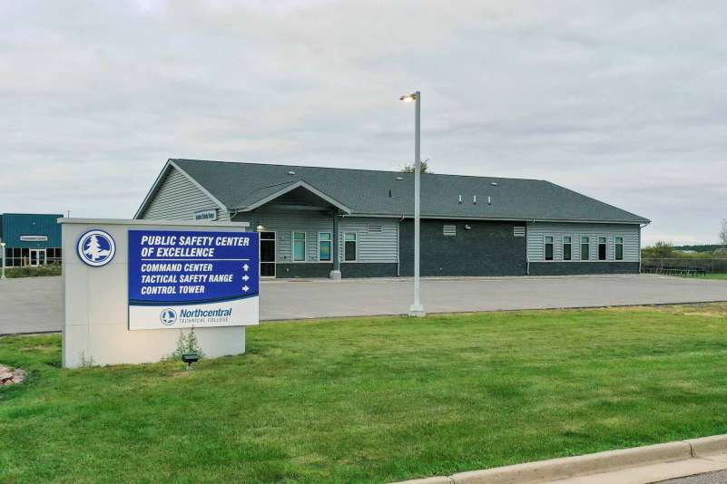 The Tactical Safety Range at the Public Safety Center of Excellence, with signage in the foreground, directing visitors to the Command Center, Tactical Safety Range, and Control Tower