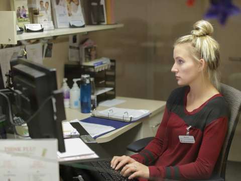 Rachel Meier working on her computer at Marshfield Clinic