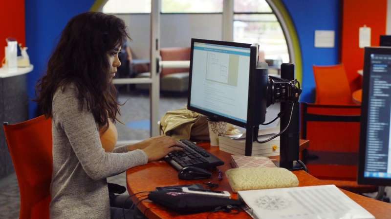 Student working on a computer in the NTC iTEC