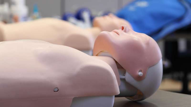 CPR training manikin laying on a table