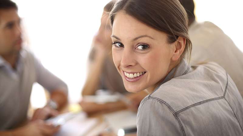 Young female in business casual attire.