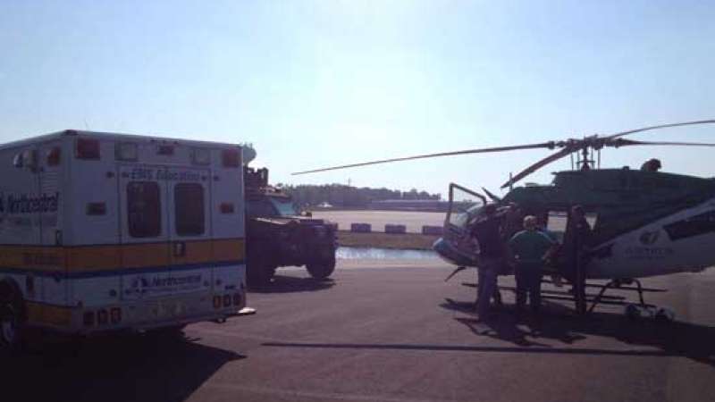 Air Medical Landing Zone at the Public Safety Center of Excellence with an ambulance parked on the left and a helicopter parked on the right.