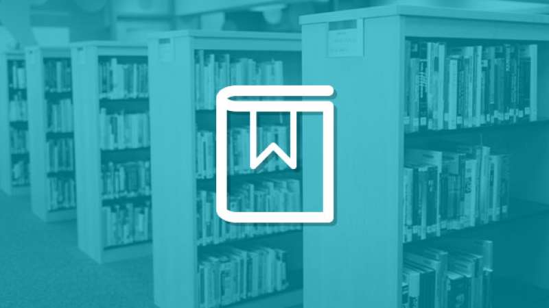 A symbol of a book with a bookmark is overlayed on top of an image of an internal view of the NTC Library