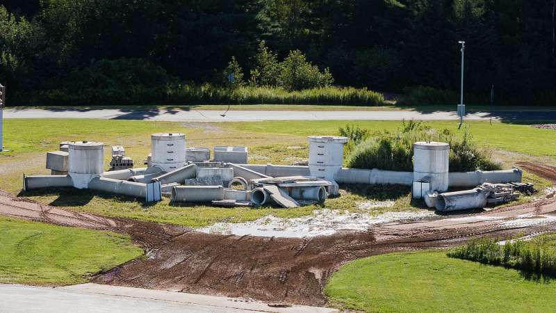 Large cement pipes are positioned in a field to simulate a search and rescue mission within confined spaces.