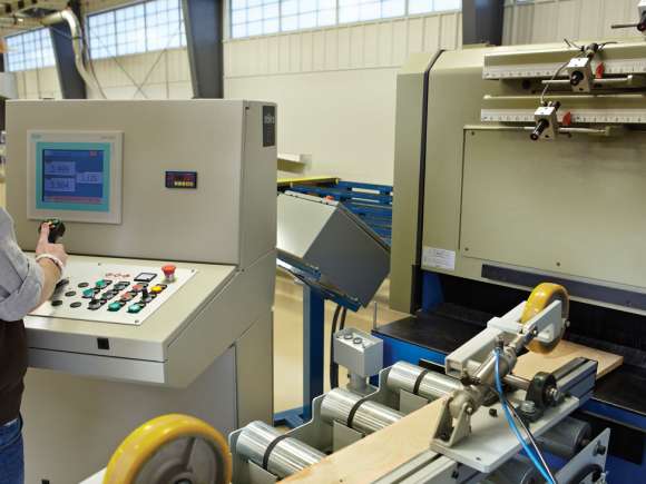 A student using precision equipment at the Wood Technology Center of Excellence.