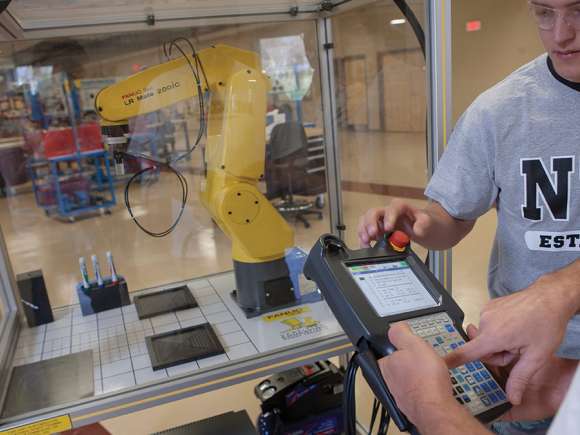 Students working with a robot