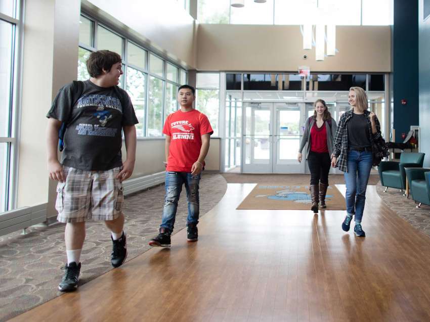 Students walking in the front entrance of the Wausau campus