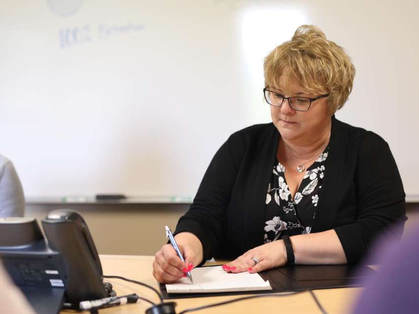 Businesswoman works on a writing a grant.