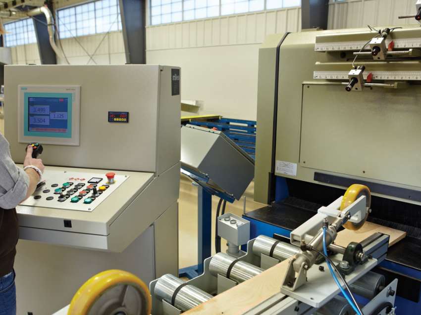 A student using precision equipment at the Wood Technology Center of Excellence.