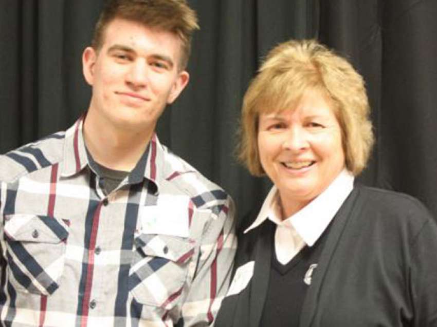 Lori Weyers Stands next to a student at the donors reception