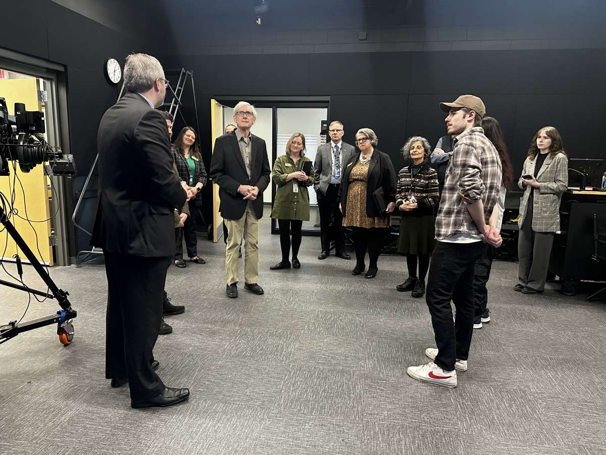 Governor Tony Evers and a group of NTC staff, faculty and students in the studio