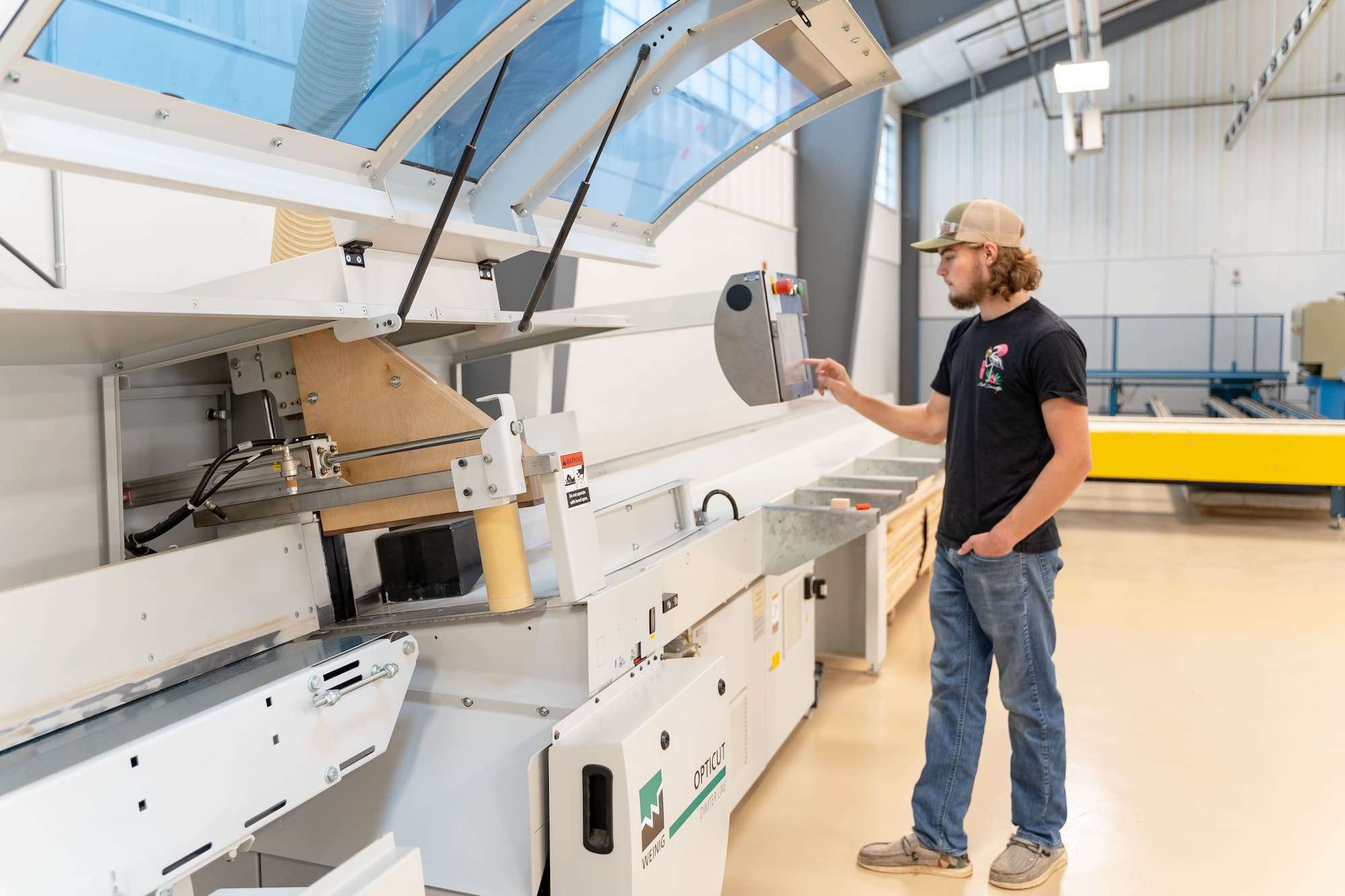 A student configures a series of material operations using an opticut control panel.